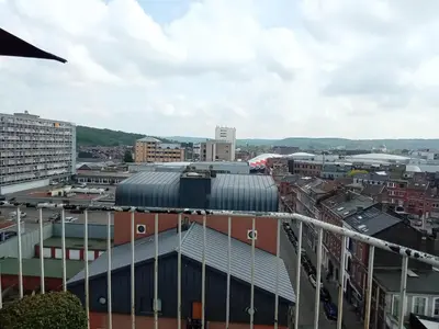a view of a city from the top of a building at Liège centre Médiacité appartement possible parking terrasse immense 8ème pour 2 personnes in Liège