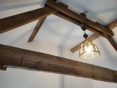 a light fixture hanging from a ceiling in a room at Loogiez in Tongeren