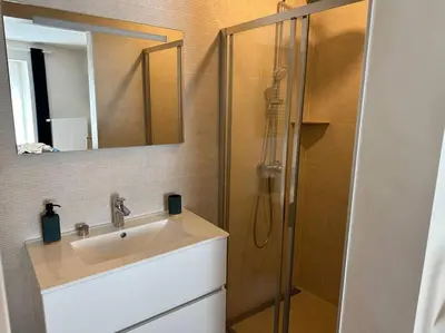 a bathroom with a sink and a shower at Jacuzzi - Sauna - BBq - Jardin - Garden Lodge - Myosotis in Olne