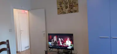 a flat screen tv sitting in a living room at Cozy studio in Hasselt in Hasselt