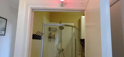 a bathroom with a shower with a light on the ceiling at Cozy studio in Hasselt in Hasselt