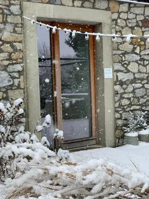 a window of a house with snow on it at Loft 88 in Eupen