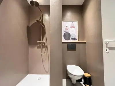 a bathroom with a shower and a toilet at 8P 4B Beautiful Villa with swimming pool in Zonhoven in Genk