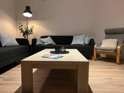 a living room with a coffee table and a couch at Boldermountain Guesthouse in Heusden - Zolder