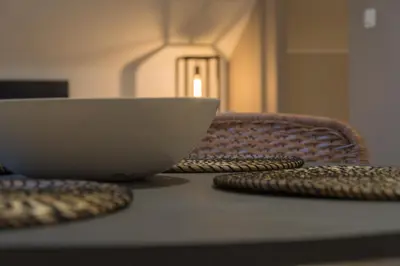 a bowl sitting on top of a table with a table at Trudo Loft in Sint-Truiden