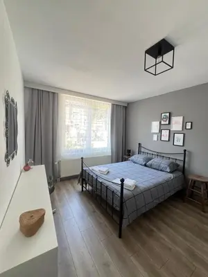 a bedroom with a bed and a window at Appartement Verviers in Verviers