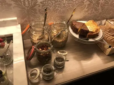 a table with a piece of cake on a plate at Boutique Hotel Huys van Steyns in Tongeren
