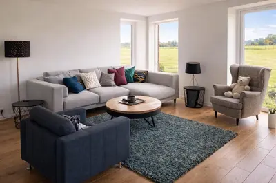 a living room with a couch and a table and chairs at Spa-Francorchamps - Jahlay - Maison 6p de caractère - Famille - Ardennes - Nature in Jalhay