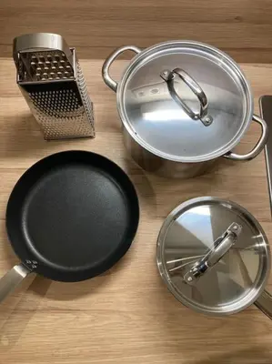 a table with a frying pan and a strainer at COCONUT MILK in Liège