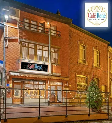 a brick building with a cafe hate sign on it at Café René Borgloon in Borgloon