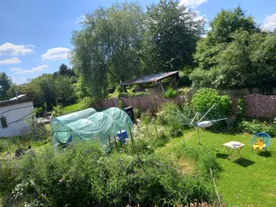 a garden with a tent in the middle of it at Gee is Sharing her home in Liège