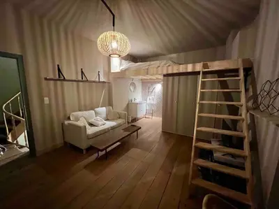 a living room with a couch and a loft bed at Maison avec 4 suites & Rooftop en plein centre ville - Place Saint Paul in Liège