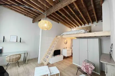 a room with a desk and a loft bed at Maison avec 4 suites & Rooftop en plein centre ville - Place Saint Paul in Liège