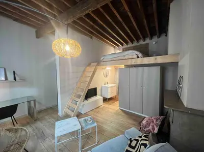 a living room with a loft bed and a desk at Maison avec 4 suites & Rooftop en plein centre ville - Place Saint Paul in Liège