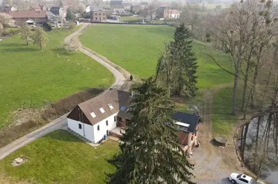 an aerial view of a house in a field at Domaine des Arches in Soumagne