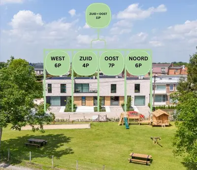 a sign in a park in front of a building at NIEUW - De Grenspaal WEST 6P 5 min Maastricht - Sauna - Laadpaal in Riemst
