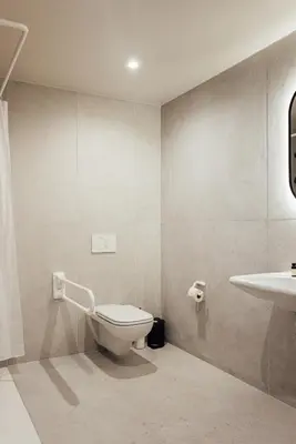 a bathroom with a toilet and a sink at Getaway Liège in Liège
