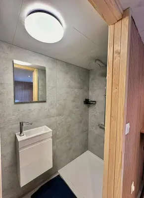 a bathroom with a toilet and a sink and a mirror at Cosy@Beauty in Petit-Rechain