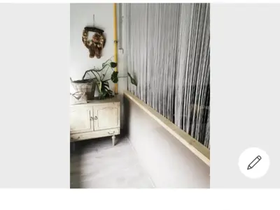 a room with a hallway with a curtain and a staircase at Vintage house ViVa in Leopoldsburg