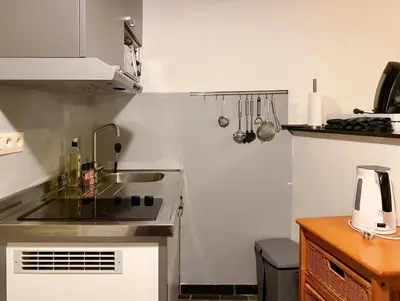 a small kitchen with a sink and a stove at Beautiful appartment in Voeren in Voeren
