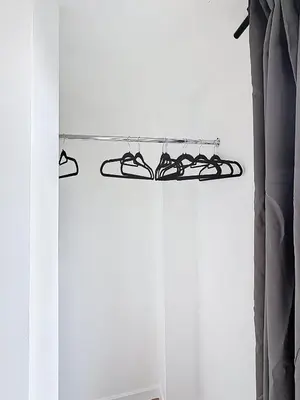 a pair of shoes on a rack in a room at Smart Appart - City Center Liege in Liège