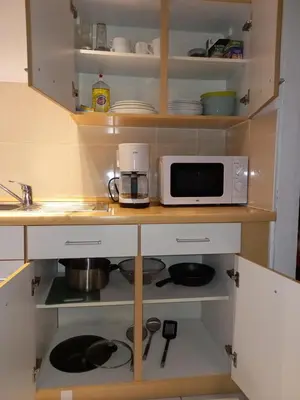 a kitchen with a microwave and a stove at Ap5 Nature Ardennes Economy class apartment in La Calamine