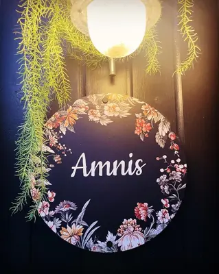 a sign that says amums hanging on a wall at Bungalow AMNIS by Sonnevijver Residences in Lanaken