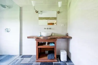 a bathroom with a sink and a mirror at Farm Stay Luythoeve in Meeuwen