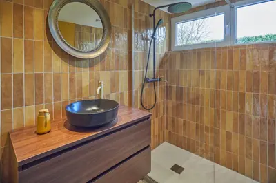 a bathroom with a sink and a mirror at Lacuna STILLA by Sonnevijver Residences in Lanaken