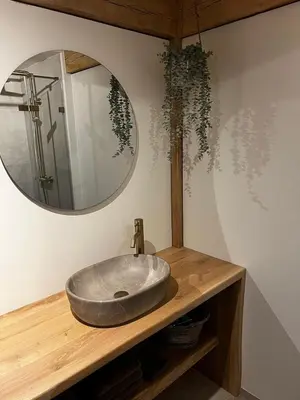a bathroom with a sink and a mirror at Chalet Hoge Kempen in Zutendaal