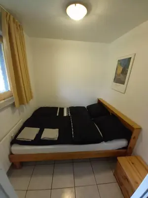 a bedroom with a bed in a room at Ap4 Nature Ardennes Economy class apartment in La Calamine