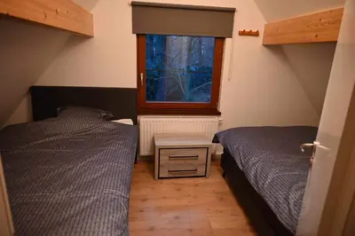 a bedroom with two beds and a window at Zwaan7, Top Locatie! Top Deal! in Rekem