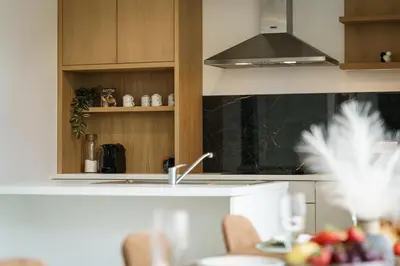 a kitchen with a sink and a stove at Nr 28 TravelHome in Heusden - Zolder