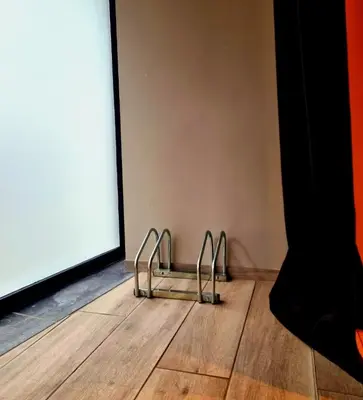 a pair of shoes on a wooden floor in a room at Aslyra 
