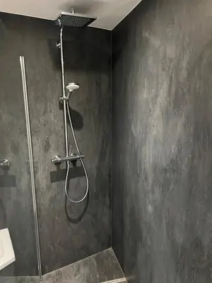 a shower with a shower head in a bathroom at LCforyou in Juprelle