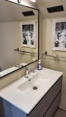 a bathroom with a white sink and a mirror at MARINA in Houthalen-Helchteren