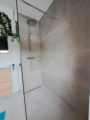 a shower with a glass door in a bathroom at Hotel Apartments Belgium 5 - HAB 5 in Balen