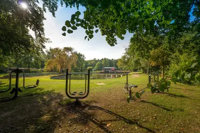 a group of golf clubs in a grass field at Jocomo Parc in Lanaken