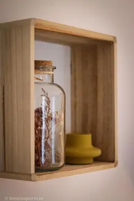 a glass jar sitting on a wooden shelf at De Millenniumhoeve (Jean) in Riemst