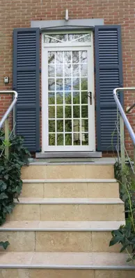 a door with stairs in front of a building at Sleep and Dream in Liège