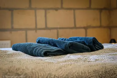 a pair of blue jeans sitting on top of a bed at Millenniumhoeve (Lieke) in Riemst