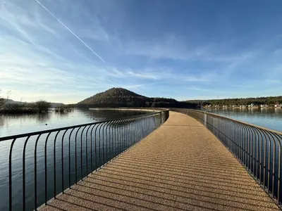 a walkway over a body of water with a fence at Villa Luna in Oudsbergen