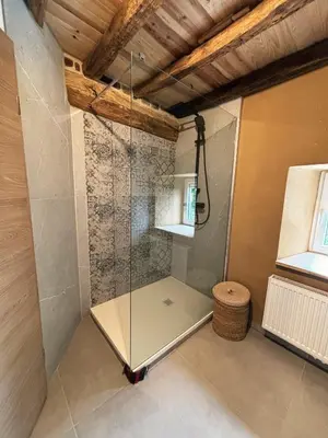 a shower with a glass door in a room at Close from Ardenne - Fully renovated modern farmhouse in Baelen in Baelen
