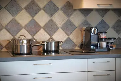 two pots sitting on top of a stove in a kitchen at Stijlvol App in Genk Centrum in Genk