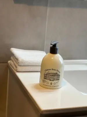 a bottle of bathroom bear stuff sitting on a counter at Maison d’Ans in Ans