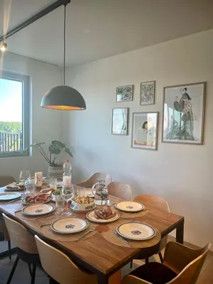 a dining room table with plates of food on it at Skylodgenk in Genk
