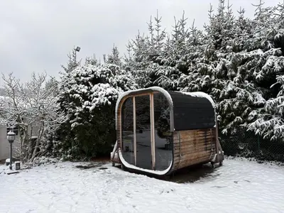 a snow covered object is sitting in the snow at Villa kleinwellness in Lanaken