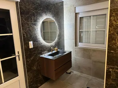 a bathroom with a sink and a mirror at Villa kleinwellness in Lanaken