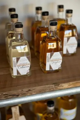 a group of bottles of whiskey on a shelf at DeStoker in Hasselt