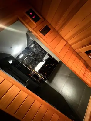 an overhead view of a kitchen with wooden cabinets at La Suite Gold Wellness Jacuzzi & Sauna in Seraing